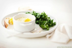 baked eggs served with sautéed kale baked eggs served with sautéed kale