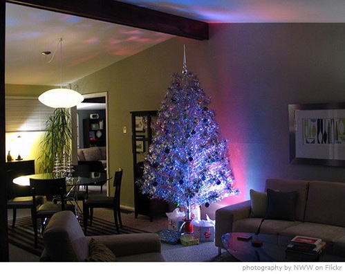 aluminum christmas tree in a modern open space living and dining room