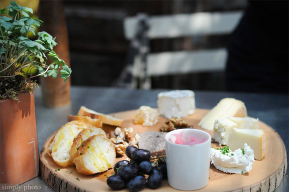 cheese and pate platter served on a wooden board :: as seen on simply photo