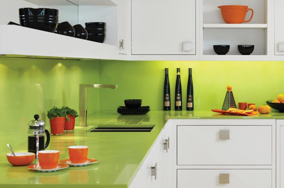 lime green glass backsplash counter surfaces in a white modern kitchen