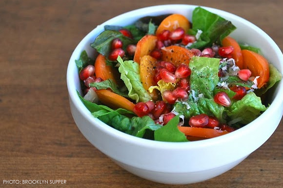 green salad with pomegranates and persimmons